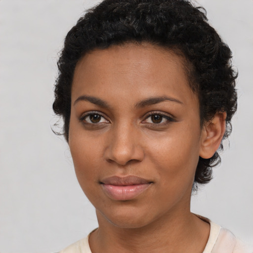 Joyful latino young-adult female with short  brown hair and brown eyes