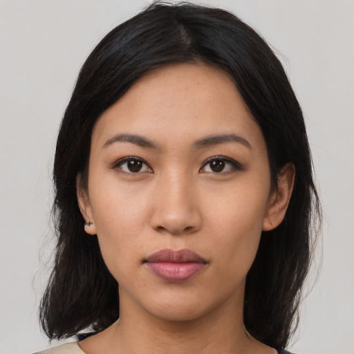 Neutral latino young-adult female with medium  black hair and brown eyes
