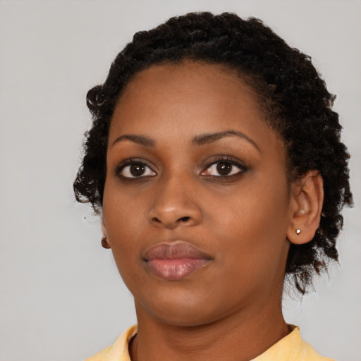 Neutral black young-adult female with short  black hair and brown eyes