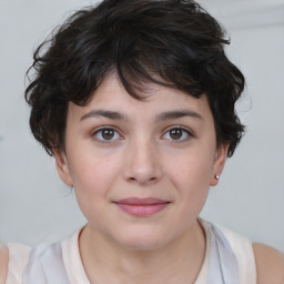 Joyful white child female with medium  brown hair and brown eyes