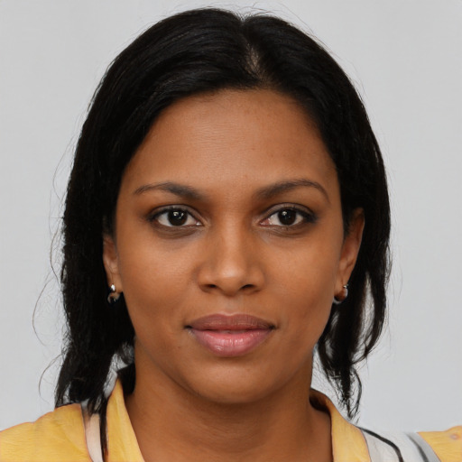 Neutral black young-adult female with medium  brown hair and brown eyes