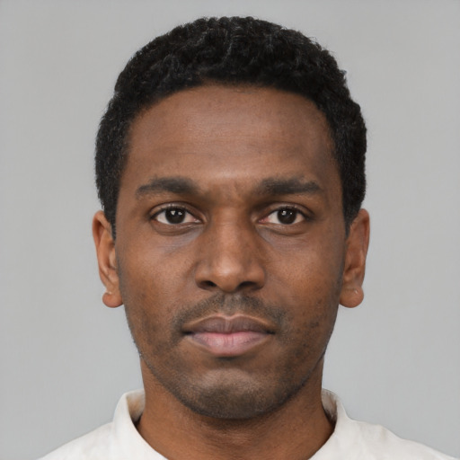Neutral black young-adult male with short  black hair and brown eyes