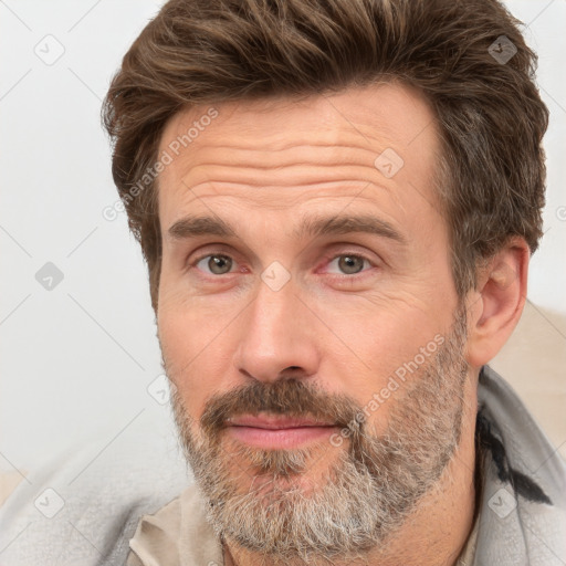 Neutral white adult male with short  brown hair and brown eyes