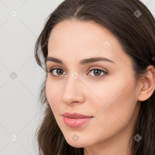 Neutral white young-adult female with long  brown hair and brown eyes