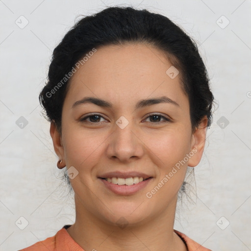 Joyful latino young-adult female with short  brown hair and brown eyes