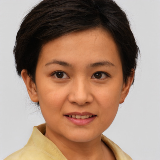 Joyful white young-adult female with medium  brown hair and brown eyes