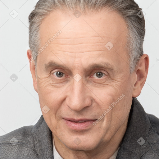 Joyful white middle-aged male with short  brown hair and brown eyes