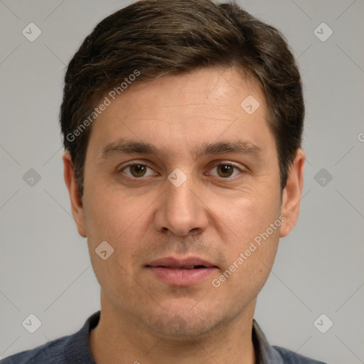 Joyful white adult male with short  brown hair and grey eyes