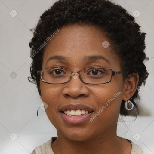 Joyful black adult female with medium  brown hair and brown eyes