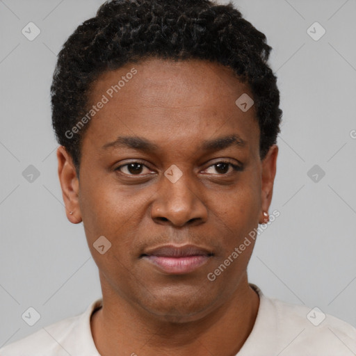Joyful black young-adult male with short  brown hair and brown eyes