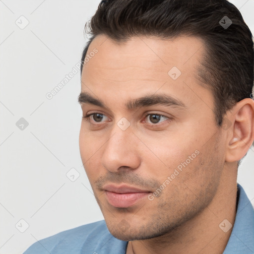 Neutral white young-adult male with short  brown hair and brown eyes