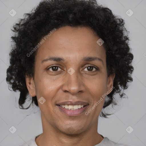 Joyful black adult female with short  brown hair and brown eyes