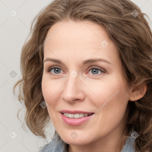 Joyful white young-adult female with medium  brown hair and blue eyes