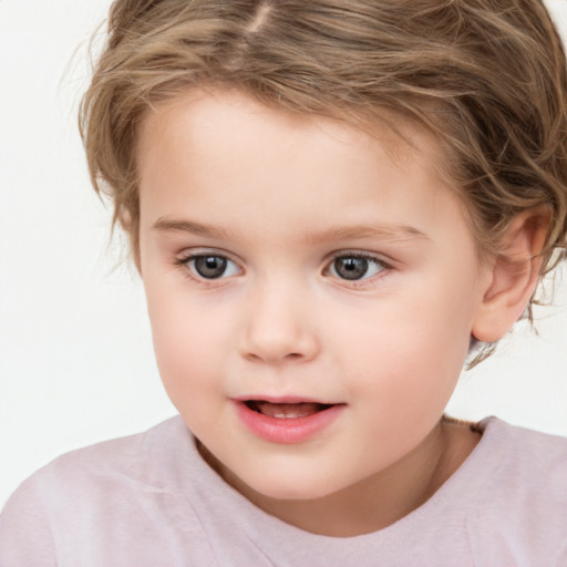 Joyful white child female with short  brown hair and brown eyes