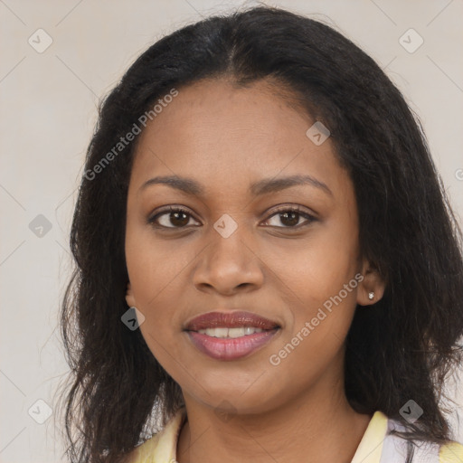 Joyful black young-adult female with long  brown hair and brown eyes