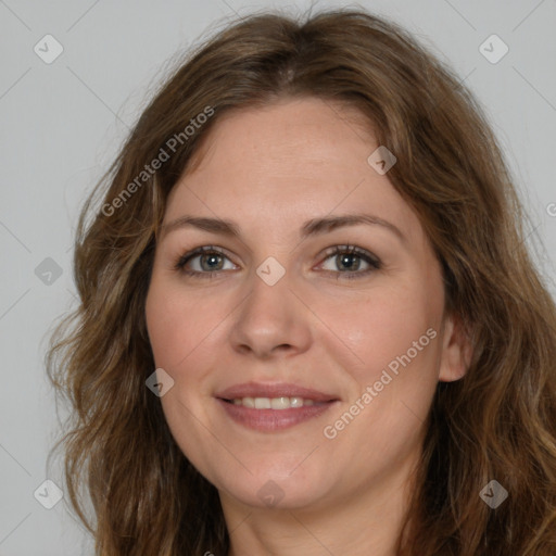 Joyful white adult female with long  brown hair and brown eyes