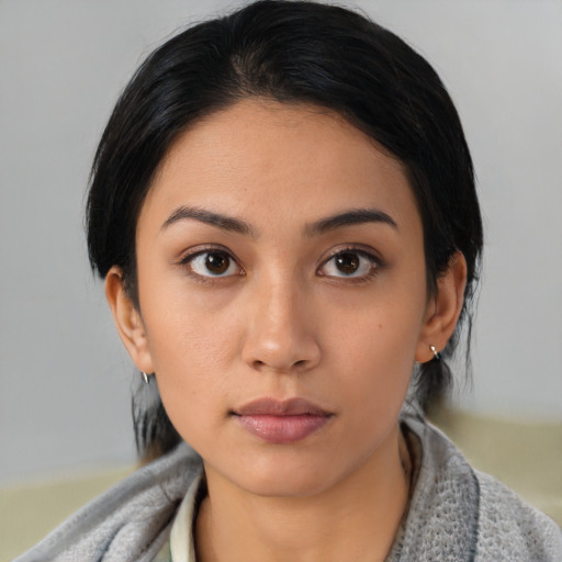 Neutral asian young-adult female with medium  brown hair and brown eyes