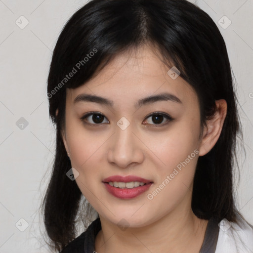 Joyful asian young-adult female with medium  black hair and brown eyes