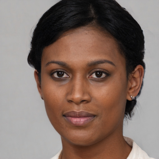 Joyful asian young-adult female with short  black hair and brown eyes