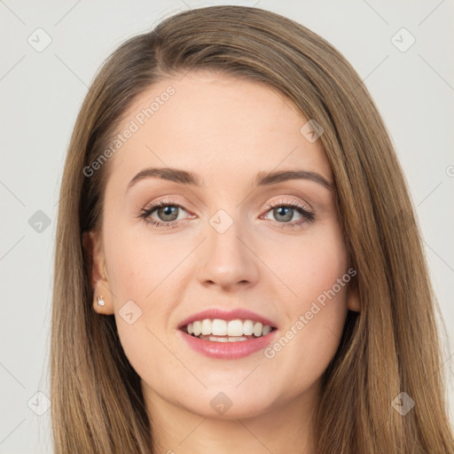 Joyful white young-adult female with long  brown hair and green eyes