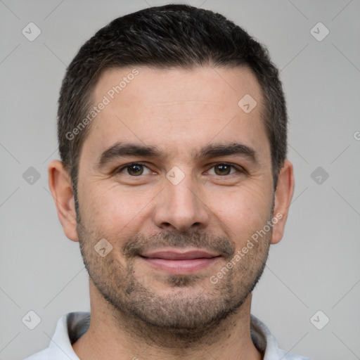 Joyful white young-adult male with short  brown hair and brown eyes