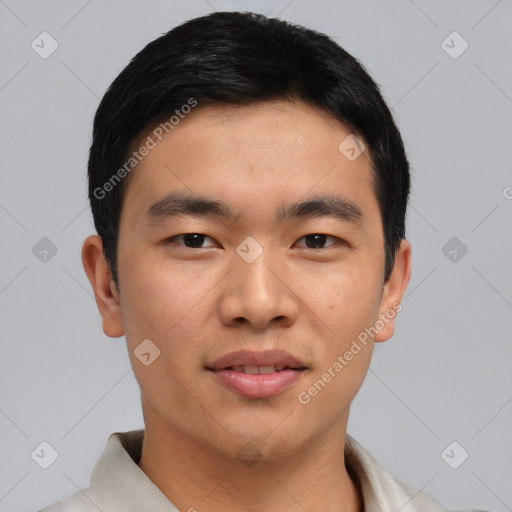 Joyful asian young-adult male with short  black hair and brown eyes