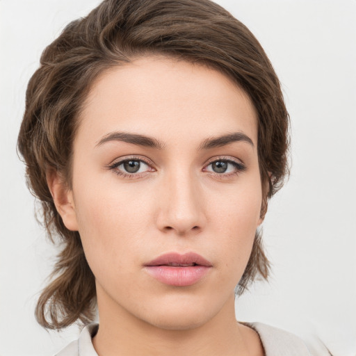 Neutral white young-adult female with medium  brown hair and brown eyes