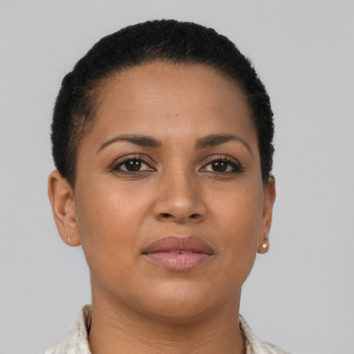 Joyful latino young-adult female with short  brown hair and brown eyes