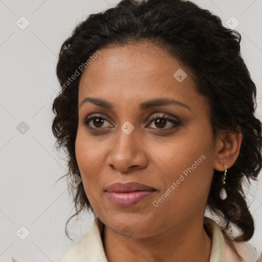 Joyful black young-adult female with medium  brown hair and brown eyes