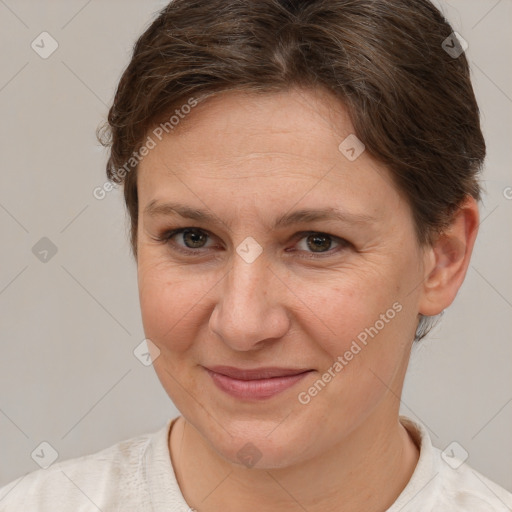 Joyful white adult female with short  brown hair and brown eyes