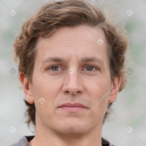 Joyful white adult male with short  brown hair and grey eyes