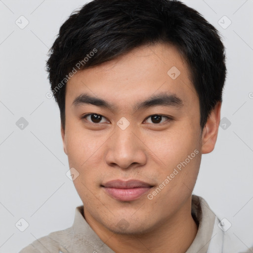 Joyful asian young-adult male with short  brown hair and brown eyes