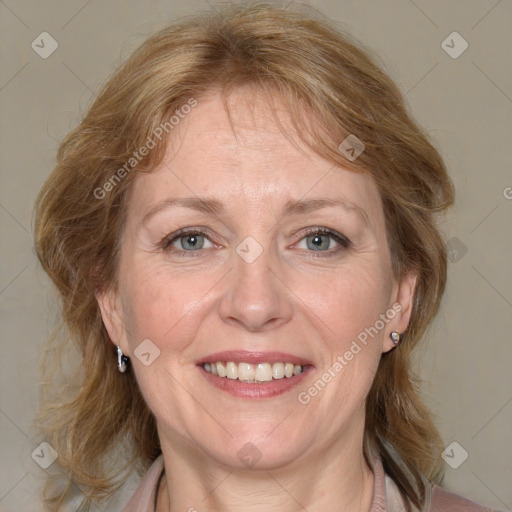 Joyful white adult female with medium  brown hair and blue eyes