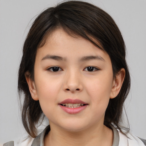 Joyful white child female with medium  brown hair and brown eyes