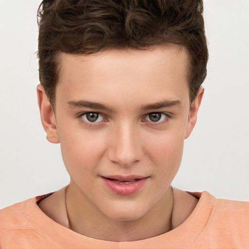 Joyful white child male with short  brown hair and brown eyes