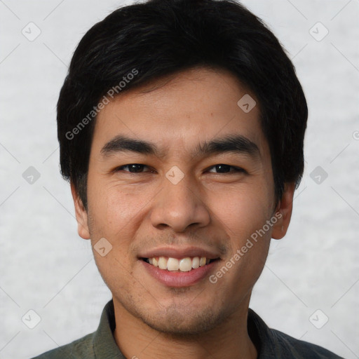 Joyful asian young-adult male with short  black hair and brown eyes