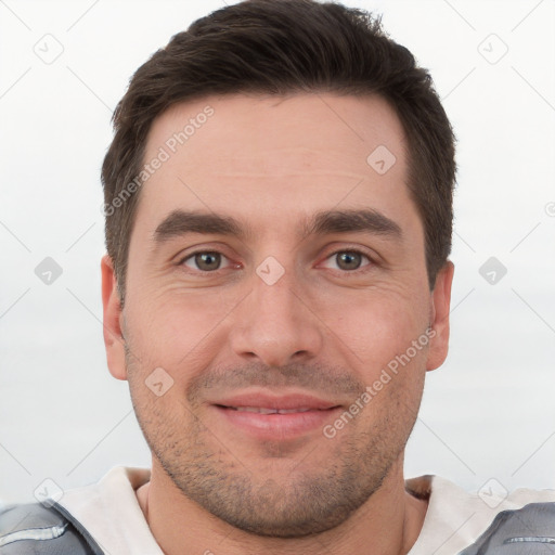 Joyful white young-adult male with short  brown hair and brown eyes