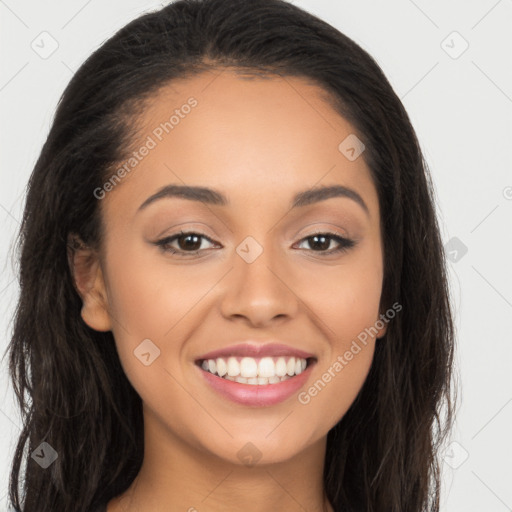 Joyful latino young-adult female with long  brown hair and brown eyes