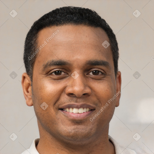 Joyful latino young-adult male with short  brown hair and brown eyes