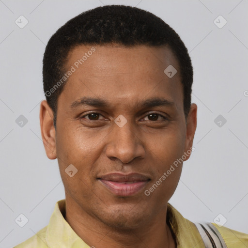 Joyful black young-adult male with short  brown hair and brown eyes