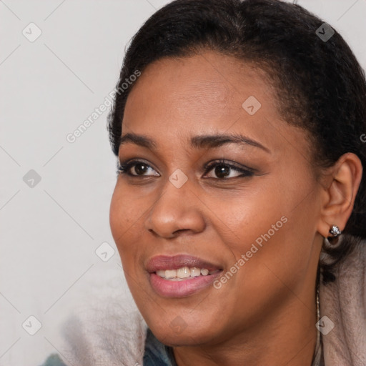 Joyful black young-adult female with short  black hair and brown eyes