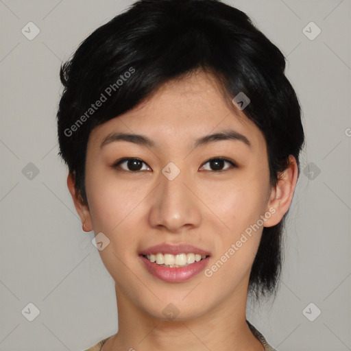 Joyful asian young-adult female with short  black hair and brown eyes