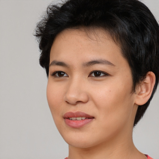Joyful asian young-adult female with short  brown hair and brown eyes