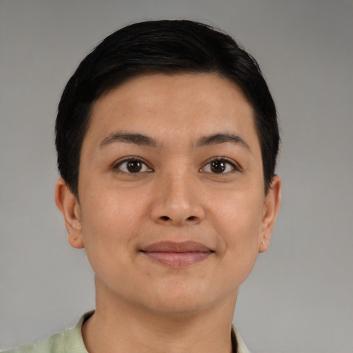 Joyful latino young-adult female with short  black hair and brown eyes