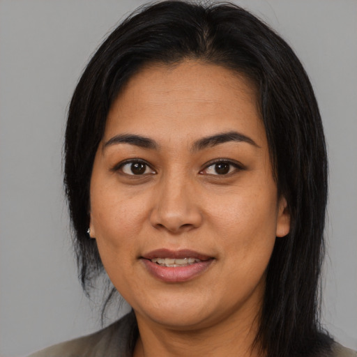 Joyful asian young-adult female with medium  black hair and brown eyes