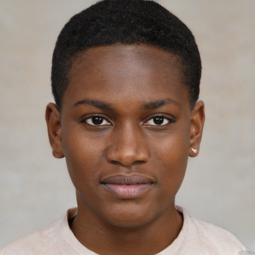 Joyful black child female with short  brown hair and brown eyes