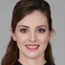 Joyful white young-adult female with medium  brown hair and brown eyes