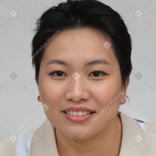 Joyful asian young-adult female with short  brown hair and brown eyes