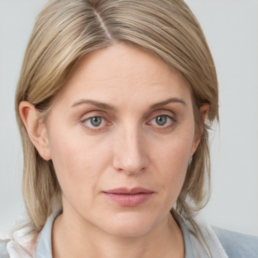 Neutral white young-adult female with medium  brown hair and grey eyes