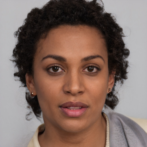 Neutral black young-adult female with short  brown hair and brown eyes
